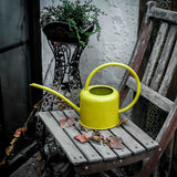 arrosoir jaune metal