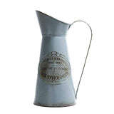 Broc Ancien en Metal | L'arroseur arrosé