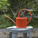 arrosoir couleur orange métal