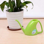 arrosoir plante verte L'arroseur arrosé