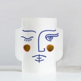 cache vase visage