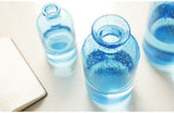 bouteille en verre bleu
